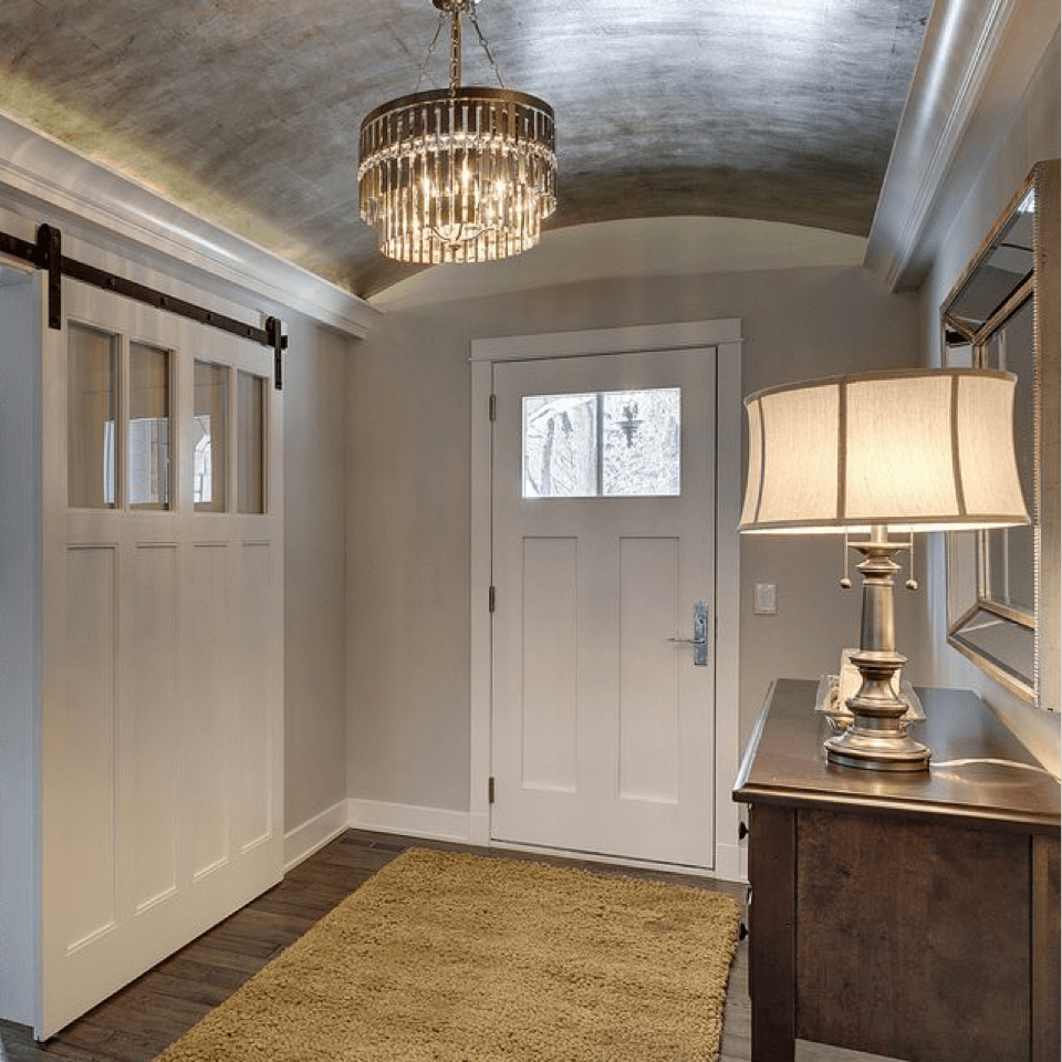 Modern, chic foyer with painted ceiling and walls